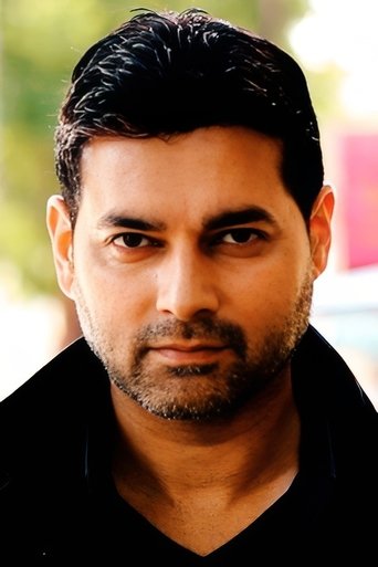 Portrait of Reef Karim